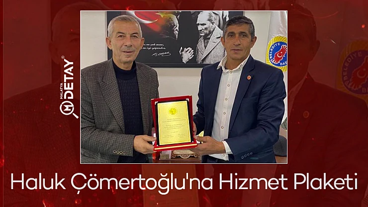Çömertoğlu'na Hizmet Plaketi...